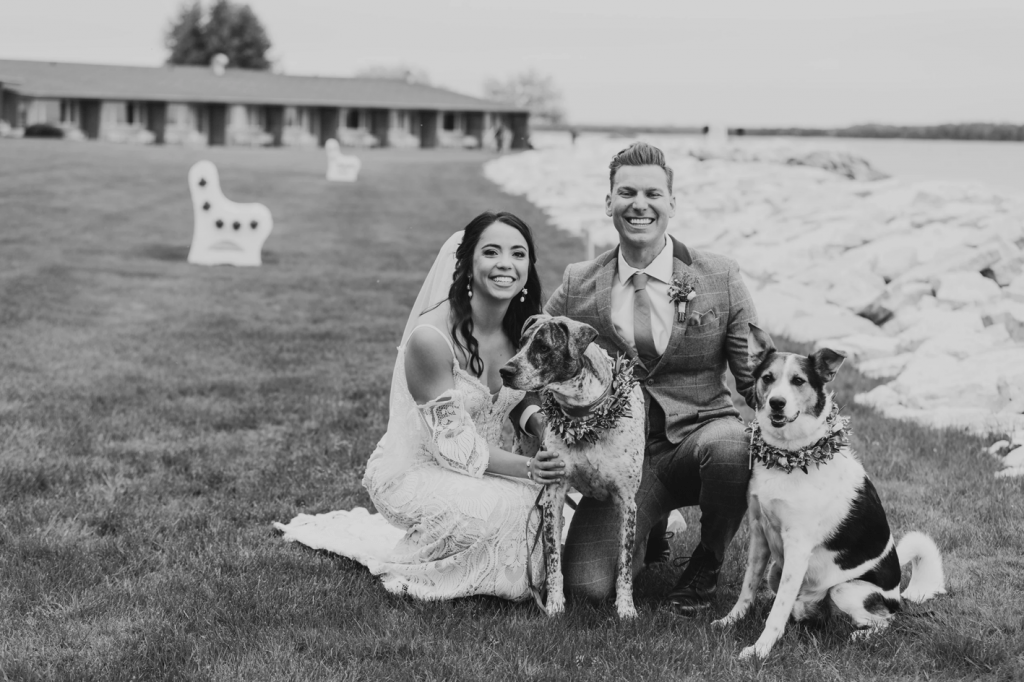 Jaimee and husband with their two dogs on their wedding day. 